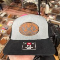 Heather grey and black trucker hat with an engraved oval leather wildlife scene patch